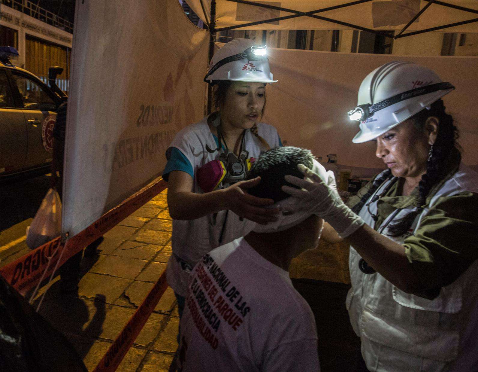 Treating people injured during the protests in Lima
