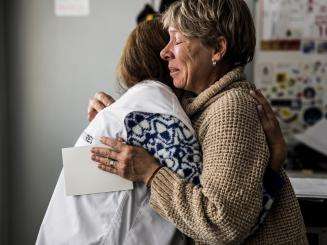 MSF psychologist Vika hugs Antonina Sakhnovska, an MSF mental health patient in Kharkiv, when she begins to cry when she remembers her husband, who died in the war.