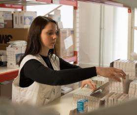 An MSF pharmacist chooses medicines in Zhytomyr, Ukraine.