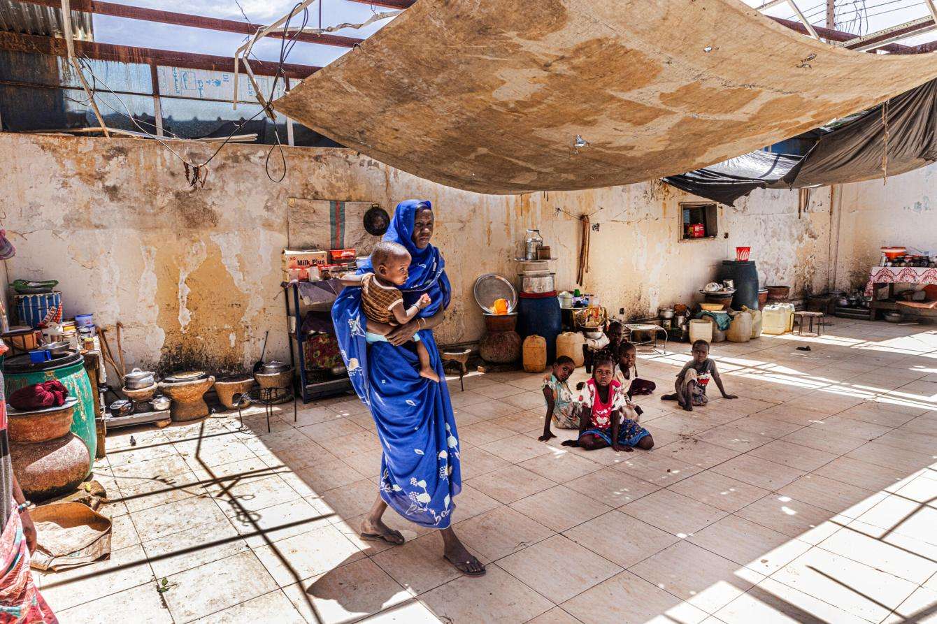 A displaced woman holding her child in Zalingei city, capital of Central Darfur state, Sudan.