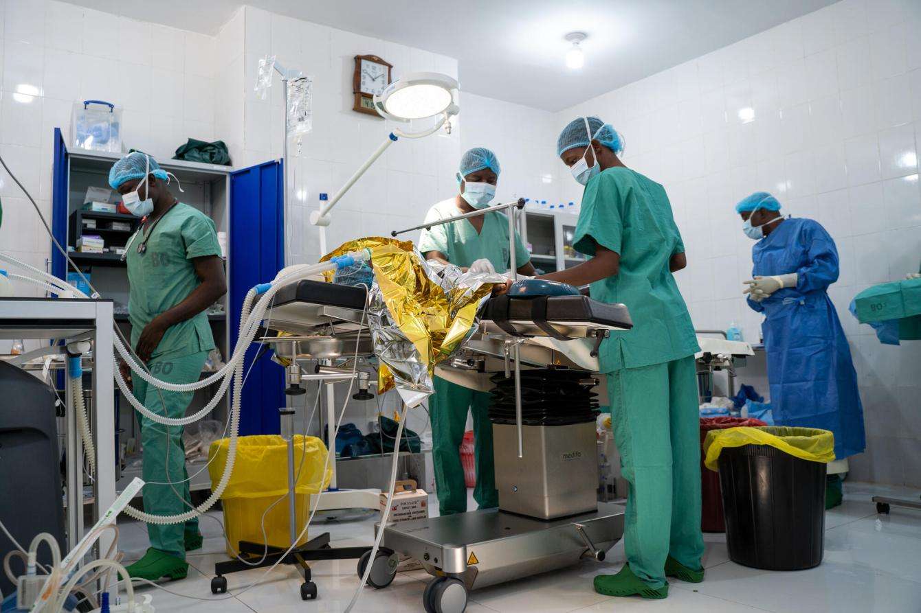 Surgeons operate on a patient who was a victim of gun violence in Mali.